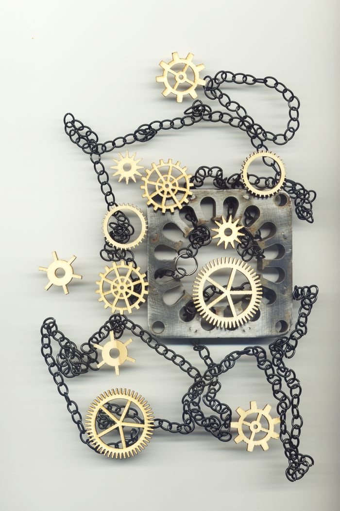 services-04 Artistic display of gears and chains, perfect for industrial-themed projects.