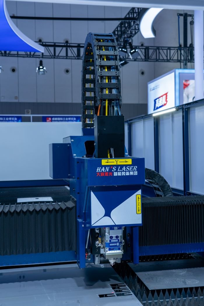 Close-up view of an advanced industrial laser cutting machine in operation showcasing precision technology.