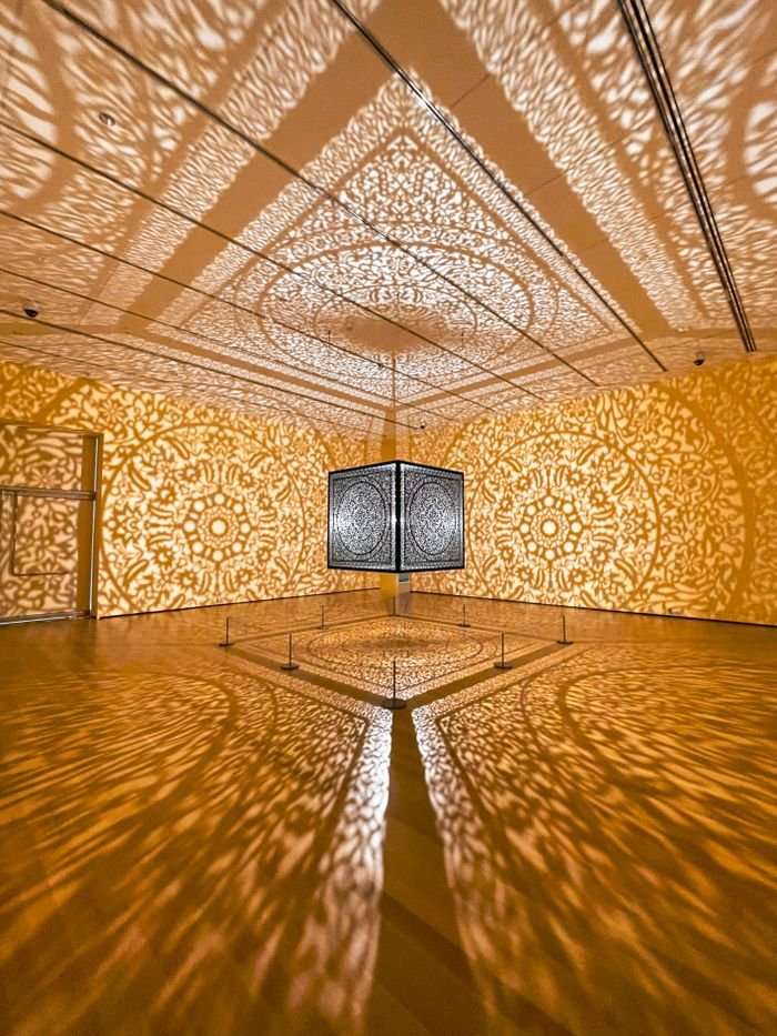 Art installation casting intricate light patterns in museum, Salem, MA.