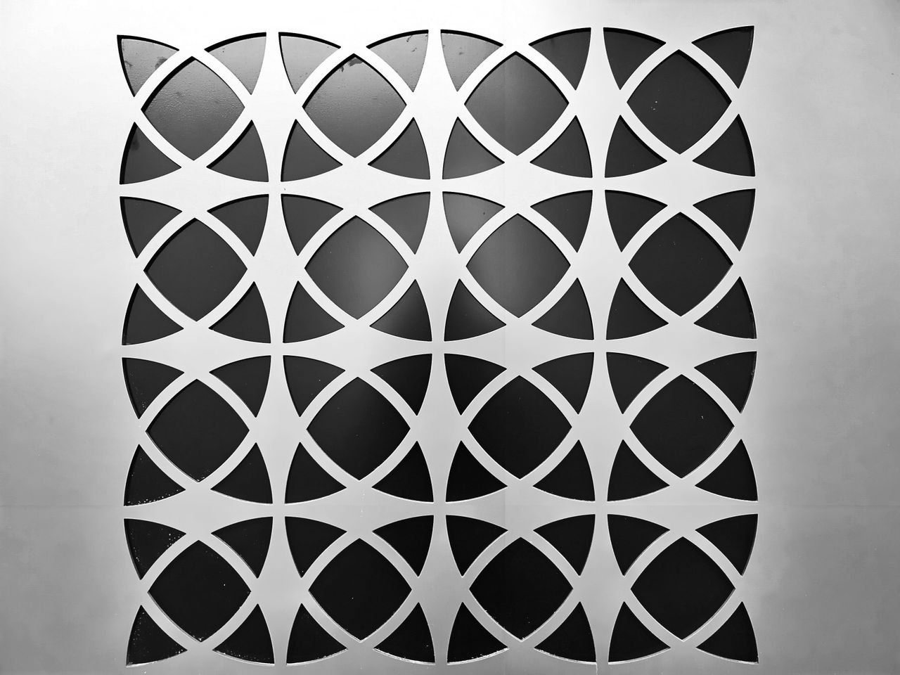 services-03 Black and white geometric pattern with abstract shapes creating a modern design.